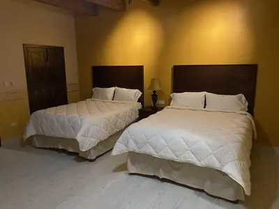 Cama o camas de una habitación en Hotel Real de los Alamos