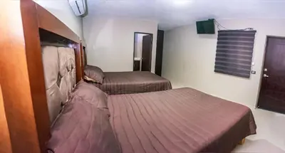 Cama o camas de una habitación en Hotel EL MILAGRO