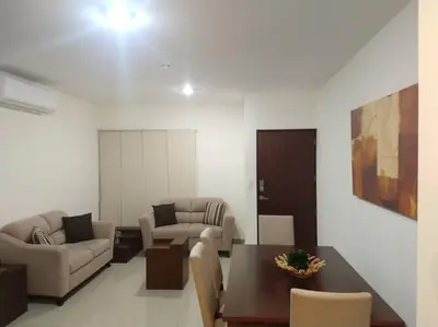 Zona de estar de Departamento a 200 Mts de la playa y alberca en planta baja