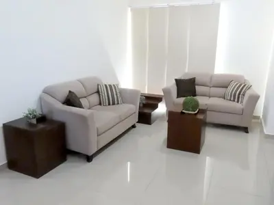 Zona de estar de Departamento a 200 Mts de la playa y alberca en planta baja