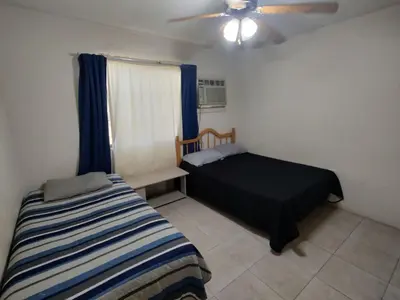 Cama o camas de una habitación en Hospedajes la Quinta