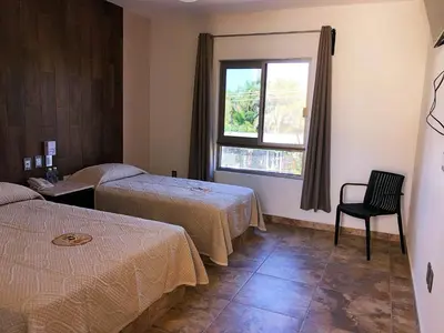 Cama o camas de una habitación en Hotel Conquistador