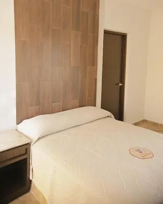 Cama o camas de una habitación en Hotel Conquistador