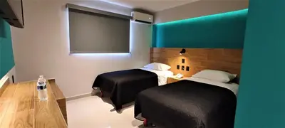 Cama o camas de una habitación en Hotel Kavia Mazatlán