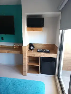 Una televisión o centro de entretenimiento en Hotel Kavia Mazatlán