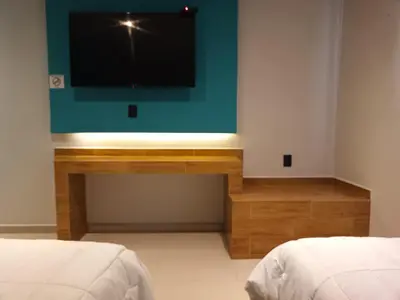Cama o camas de una habitación en Hotel Kavia Mazatlán