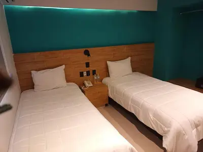 Cama o camas de una habitación en Hotel Kavia Mazatlán