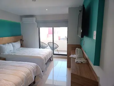 Cama o camas de una habitación en Hotel Kavia Mazatlán
