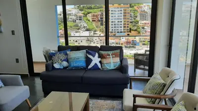 Zona de estar de BOCA DE CIELO Departamento frente al mar con ocasos increíbles