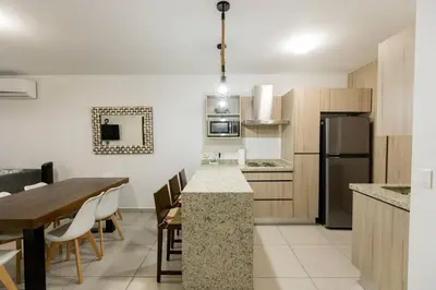 Una cocina o zona de cocina en Moderno Departamento En Residencial Privado