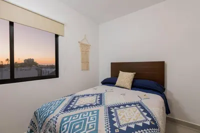 Cama o camas de una habitación en Moderno Departamento En Residencial Privado