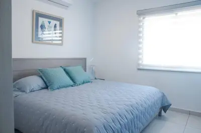 Cama o camas de una habitación en Espectacular Departamento Cerca de la Playa