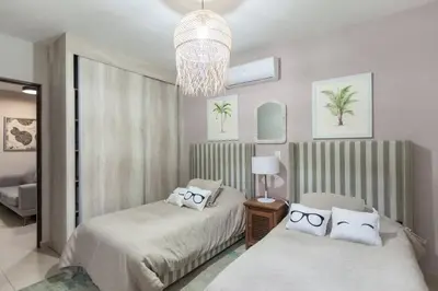 Cama o camas de una habitación en Casa Caracol. Cerca de la playa en residencial privado!