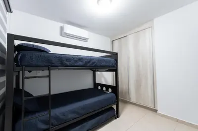 Cama o camas de una habitación en Casa en residencial para 8 personas cerca de la playa!!