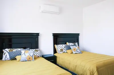 Cama o camas de una habitación en Casa con amplia terraza y vista a la alberca!