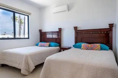 Cama o camas de una habitación en Agradable casa con terraza y vista a la alberca