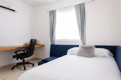 Cama o camas de una habitación en Surf House! Bonita casa vacacional en excelente ubicación