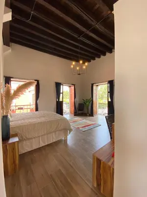 Cama o camas de una habitación en Palacio de las Rosas