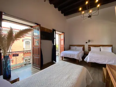Cama o camas de una habitación en Palacio de las Rosas