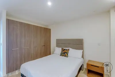 Cama o camas de una habitación en Hermosa terraza con vista a la laguna!