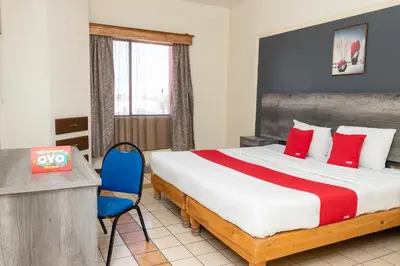 Cama o camas de una habitación en OYO Hotel Real Del Sur, Estadio Chihuahua