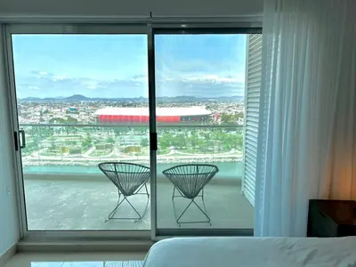 Cama o camas de una habitación en The One D16 Sobre el Malecón Vista al Estadio de Baseball