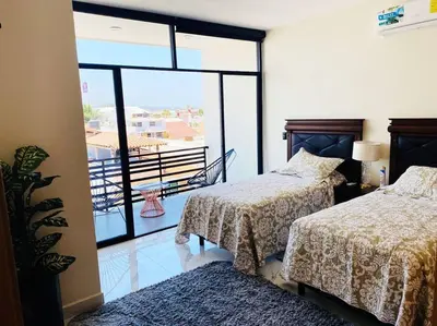 Cama o camas de una habitación en HERMOSO DEPARTAMENTO A UNOS PASOS DE LA PLAYA