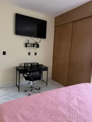 Una televisión o centro de entretenimiento en HERMOSO DEPARTAMENTO A UNOS PASOS DE LA PLAYA
