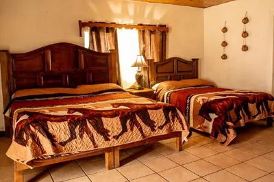 Cama o camas de una habitación en Hotel Doña Crucita