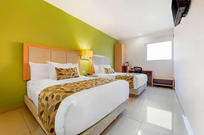Cama o camas de una habitación en Sleep Inn Culiacan