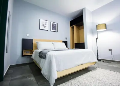 Cama o camas de una habitación en Nidah Condominios