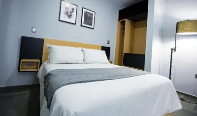 Cama o camas de una habitación en Nidah Condominios