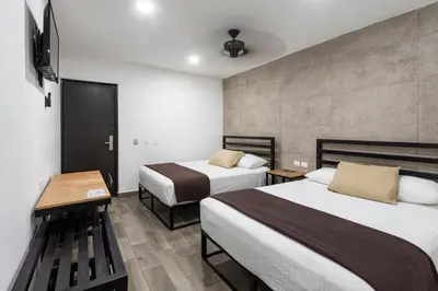 Cama o camas de una habitación en Capital Hotel Saltillo
