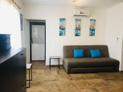 Zona de estar de Departamento a solo unos pasos de playa algodones