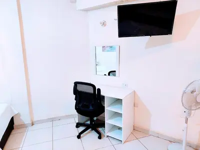 Una televisión o centro de entretenimiento en Apartamento 12 con dos camas , a 200 mts del vado del rio , cerca del centro de gobierno , internet de alta velocidad