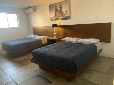 Cama o camas de una habitación en HOTEL MARIPINA