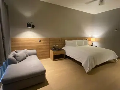 Cama o camas de una habitación en RIVI GRAND HOTEL