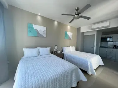 Cama o camas de una habitación en Hotel Tramonto Mazatlan