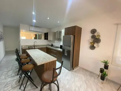 Una cocina o zona de cocina en Lovely 2 bedroom oceanfront condo in Mazatlan