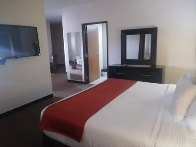 Cama o camas de una habitación en Hotel La Mina Parral