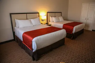 Cama o camas de una habitación en Hotel La Mina Parral