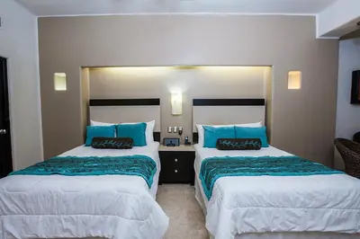 Cama o camas de una habitación en Zafiro Beach Boutique Resort
