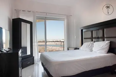 Cama o camas de una habitación en Spacious Apartment with Pool Facing the Ocean in Mazatlán - Marina