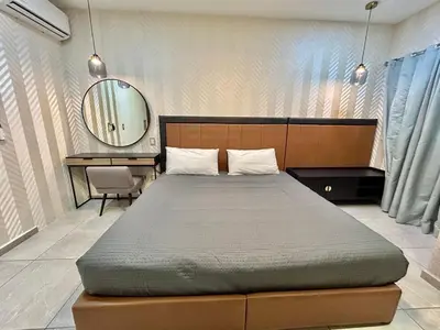 Cama o camas de una habitación en Habitación hotelera 5min de la playa by G P S rentas