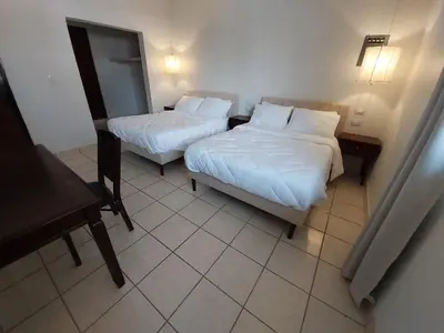 Cama o camas de una habitación en Point City Hotel