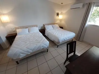Cama o camas de una habitación en Point City Hotel