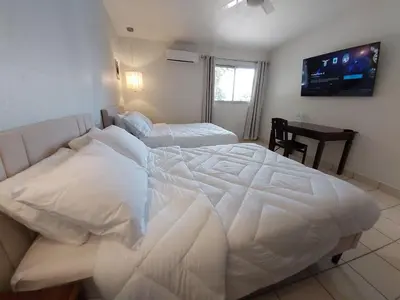 Cama o camas de una habitación en Point City Hotel