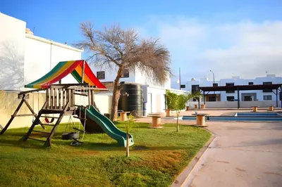 Zona de juegos infantil en ALBERCA 3 HABITACIONES, CERCA DE LA PLAYA, Cantera Residencial