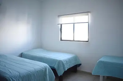 Cama o camas de una habitación en ALBERCA 3 HABITACIONES, CERCA DE LA PLAYA, Cantera Residencial