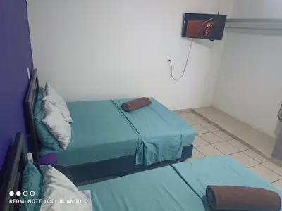 Cama o camas de una habitación en Casa sencilla, primer piso bien ubicada